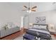 Cozy staged bedroom with a ceiling fan, and a comfortable bed. Dresser with decor at 1807 Sugar Hollow Dr, Charlotte, NC 28214