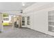 Enclosed sunroom with carpet, ceiling fan, and sliding doors to the outside at 1807 Sugar Hollow Dr, Charlotte, NC 28214
