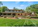 Expansive backyard featuring a pergola, wood deck, patio, and professionally landscaped yard at 1816 5Th Nw St, Hickory, NC 28601