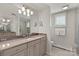 Bathroom featuring a vanity with marble countertop, framed mirror, and a glass enclosed shower at 1816 5Th Nw St, Hickory, NC 28601