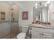 Bathroom featuring a glass shower, vanity with granite countertops, and neutral tones at 1816 5Th Nw St, Hickory, NC 28601