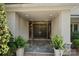 Welcoming entryway with double doors, decorative glass, stone tile, and stylish planters at 1816 5Th Nw St, Hickory, NC 28601