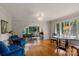 Spacious living room with hardwood floors, large windows, and elegant furnishings at 1816 5Th Nw St, Hickory, NC 28601