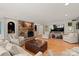 Spacious living room with hardwood floors, stone fireplace, and stylish furnishings at 1816 5Th Nw St, Hickory, NC 28601