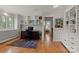 Spacious office with built-in shelving and hardwood floors, connected to hallway at 1816 5Th Nw St, Hickory, NC 28601