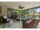 Cozy sunroom filled with natural light, comfortable seating, and views of the beautiful outdoor surroundings at 1816 5Th Nw St, Hickory, NC 28601