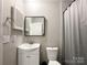 Neutral bathroom featuring a shower with curtain, standard toilet, sink and ample light at 2113 Killarney Pl, Charlotte, NC 28262