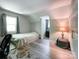 Bedroom features light grey walls, vinyl floors, an area rug, a window, and a closet at 2113 Killarney Pl, Charlotte, NC 28262