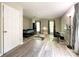 Bedroom features vinyl floors, light grey walls, and a desk near a window at 2113 Killarney Pl, Charlotte, NC 28262