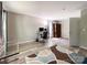 Bedroom with light gray walls, vinyl floors, and a desk in front of a window at 2113 Killarney Pl, Charlotte, NC 28262