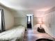 Bedroom featuring light grey walls, vinyl floors, a bed, a window, and closet at 2113 Killarney Pl, Charlotte, NC 28262