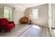 Cozy bedroom with lots of natural light, wood flooring, neutral walls, and accent furniture at 2113 Killarney Pl, Charlotte, NC 28262