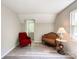 Cozy bedroom with natural light, wood flooring, neutral walls, and accent furniture at 2113 Killarney Pl, Charlotte, NC 28262