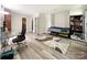 Spacious bedroom with light grey walls, vinyl floors, an area rug, and features office desk and chair at 2113 Killarney Pl, Charlotte, NC 28262