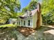 A charming two-story home featuring classic design elements and a brick chimney at 2113 Killarney Pl, Charlotte, NC 28262