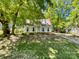 Quaint two-story home with a well-manicured front yard and inviting curb appeal at 2113 Killarney Pl, Charlotte, NC 28262