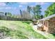 Backyard with a large, grassy lawn, a gazebo, and a charming playhouse at 212 Brookwood Dr, Salisbury, NC 28146