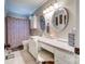 Bathroom featuring a vanity with dual mirrors, and a patterned shower curtain at 212 Brookwood Dr, Salisbury, NC 28146