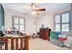 room with neutral carpet, a ceiling fan, and two windows with lots of light at 212 Brookwood Dr, Salisbury, NC 28146