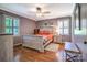 Bedroom featuring hardwood floors, many windows for natural light, and neutral paint at 212 Brookwood Dr, Salisbury, NC 28146