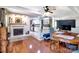 Open dining area with hardwood floors, a fireplace, and seamless transition to the kitchen at 212 Brookwood Dr, Salisbury, NC 28146