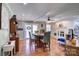 Dining area featuring a wooden table, hardwood floors, and a view of the fireplace at 212 Brookwood Dr, Salisbury, NC 28146
