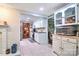 Bright kitchen featuring white cabinets, stainless steel appliances, and tiled flooring at 212 Brookwood Dr, Salisbury, NC 28146