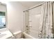 Clean bathroom with white fixtures and a shower/tub combo with a floral curtain at 2141 Talbert Ct, Charlotte, NC 28214