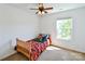 Bright bedroom boasts large window providing ample light and a ceiling fan at 2141 Talbert Ct, Charlotte, NC 28214