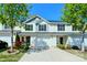 Charming townhome with a well manicured front yard and driveway that leads up to a two-car garage at 2141 Talbert Ct, Charlotte, NC 28214