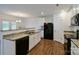 Well-lit kitchen featuring granite countertops and black appliances at 2141 Talbert Ct, Charlotte, NC 28214