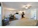 Open-concept living and dining area that opens to the kitchen with a ceiling fan at 2141 Talbert Ct, Charlotte, NC 28214