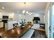 Open concept living and dining area with hardwood floors, access to the kitchen and back yard at 2141 Talbert Ct, Charlotte, NC 28214