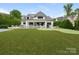 Aerial view of backyard, showcasing pool, sports court, and manicured lawn at 2343 Vernon Dr, Charlotte, NC 28211