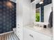 Well decorated bathroom with a stylish sink, drawers, cabinets and patterned floor at 2343 Vernon Dr, Charlotte, NC 28211
