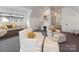 Bright bonus room with armchairs, daybed, and desk; perfect for a playroom or second living space at 2343 Vernon Dr, Charlotte, NC 28211