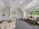 Versatile bonus room with built-in shelving, ample natural light, and comfortable seating at 2343 Vernon Dr, Charlotte, NC 28211