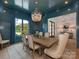 Sophisticated dining room with a decorative chandelier, stylish furnishings, and serene window views at 2343 Vernon Dr, Charlotte, NC 28211
