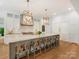 Open-concept kitchen boasts a generous island, chic pendant lights, and top-tier stainless steel appliances at 2343 Vernon Dr, Charlotte, NC 28211