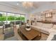 Open-concept living room with access to the kitchen and sliding glass doors to the backyard at 2343 Vernon Dr, Charlotte, NC 28211