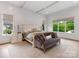 Spacious main bedroom with hardwood floors, accent furniture, natural light, and neutral tones at 2343 Vernon Dr, Charlotte, NC 28211