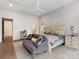 Bright main bedroom featuring a seating area, ensuite bathroom, and hardwood floors at 2343 Vernon Dr, Charlotte, NC 28211