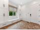 Functional mudroom with built-in storage, bench seating, and stylish herringbone floors at 2343 Vernon Dr, Charlotte, NC 28211