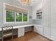 Bright office space with hardwood floors, built-in cabinets, and a large window at 2343 Vernon Dr, Charlotte, NC 28211
