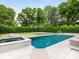 Stunning pool area featuring a diving board, hot tub, and lounge chairs at 2343 Vernon Dr, Charlotte, NC 28211