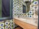 Chic powder room featuring designer wallpaper, marble countertop, and modern fixtures at 2343 Vernon Dr, Charlotte, NC 28211