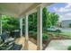 Charming back porch provides outdoor seating, a grill, and a view of the landscaped backyard at 2355 Crockett Park Pl, Charlotte, NC 28203