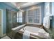 Bathroom with garden tub and glass enclosed shower featuring tiled walls at 2355 Crockett Park Pl, Charlotte, NC 28203