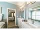 Bathroom featuring double vanity and tub/shower combo viewed from water closet at 2355 Crockett Park Pl, Charlotte, NC 28203