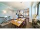 Stylish dining area with hardwood floors, view of the kitchen, and staircase to the upper level at 2355 Crockett Park Pl, Charlotte, NC 28203